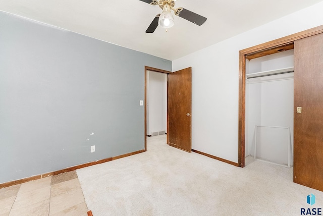 unfurnished bedroom with a closet and ceiling fan