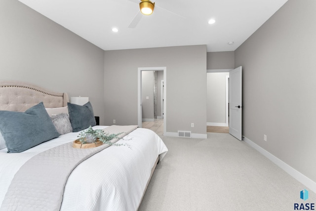 carpeted bedroom with ceiling fan