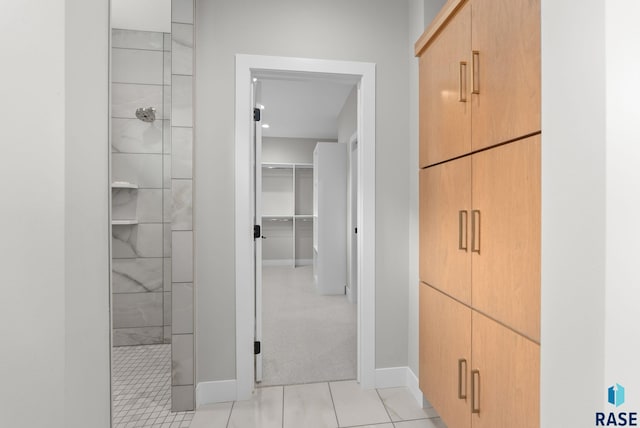 hallway featuring light tile patterned floors