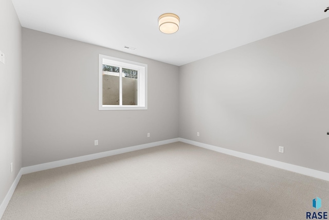 unfurnished room featuring carpet flooring