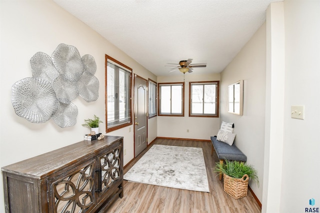 interior space featuring ceiling fan