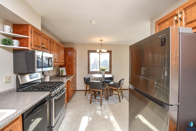 kitchen with a chandelier, pendant lighting, and stainless steel appliances