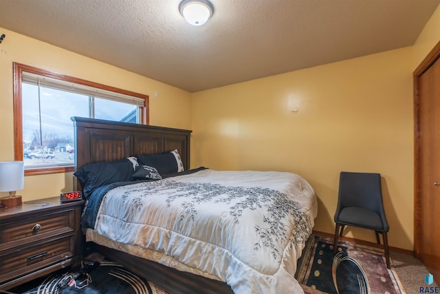 carpeted bedroom with a textured ceiling