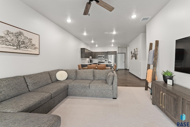 living room featuring ceiling fan