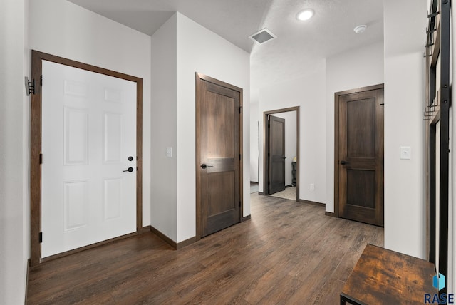 hall featuring dark wood-type flooring