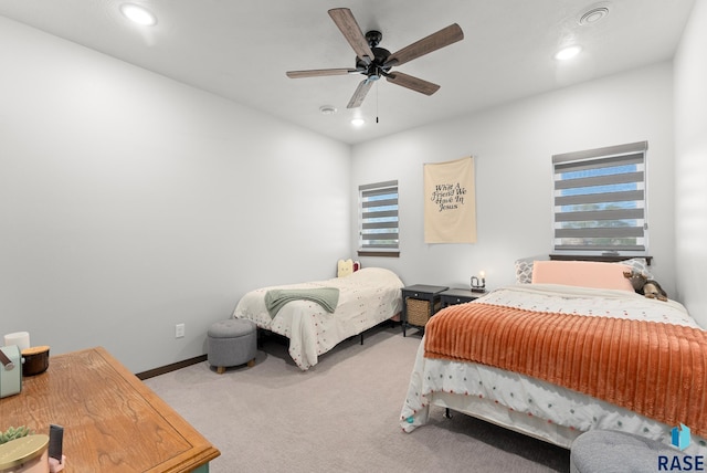 carpeted bedroom featuring ceiling fan