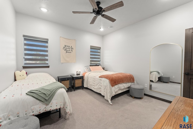 carpeted bedroom featuring ceiling fan