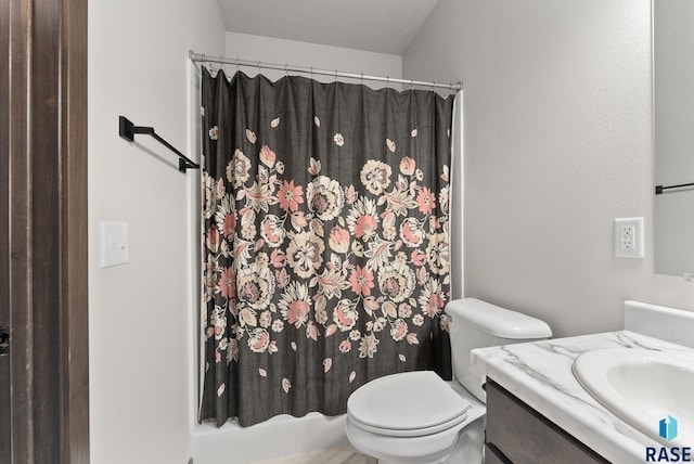 full bathroom featuring vanity, toilet, and shower / tub combo