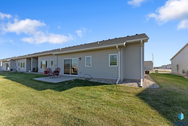 back of house with a yard, central AC unit, and a patio area