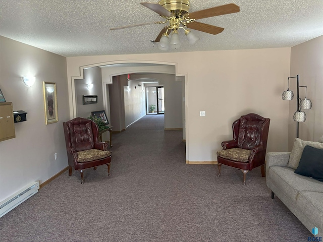 sitting room with dark colored carpet, ceiling fan, a textured ceiling, and a baseboard radiator