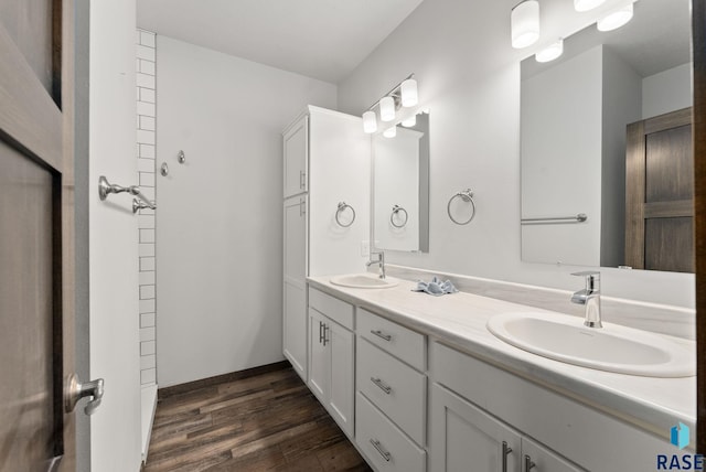 bathroom featuring vanity and hardwood / wood-style flooring