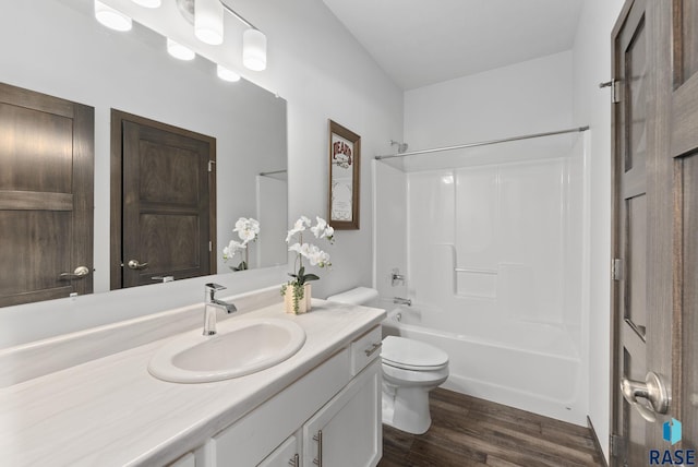 full bathroom with vanity, wood-type flooring, bathtub / shower combination, and toilet