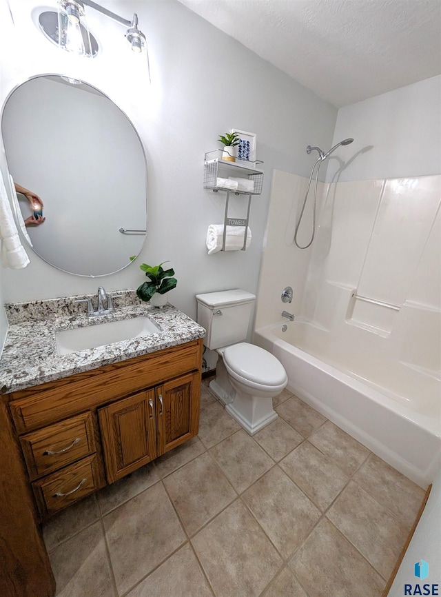 full bathroom with vanity, bathtub / shower combination, tile patterned flooring, toilet, and a textured ceiling