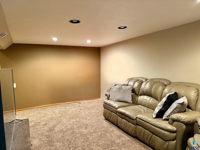 cinema with carpet flooring and vaulted ceiling