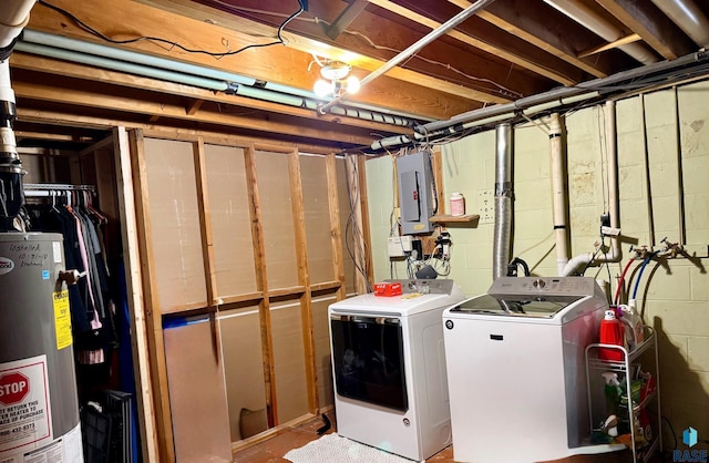 basement with washing machine and dryer, electric panel, and gas water heater