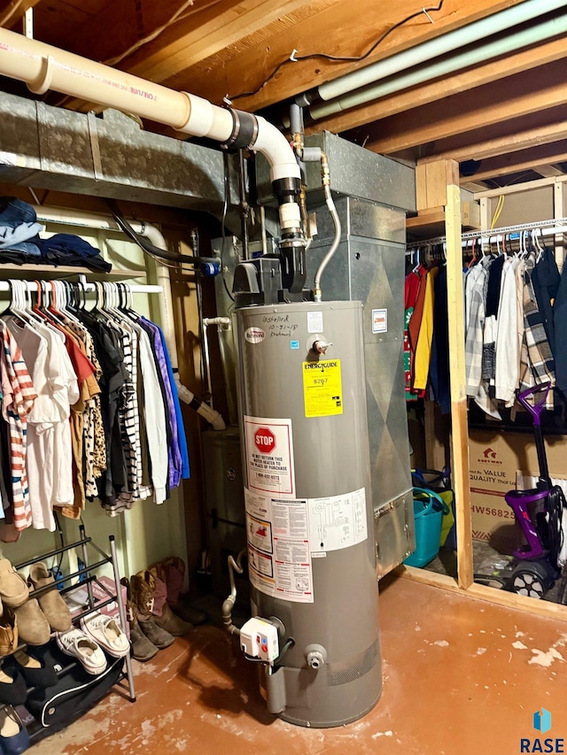 utility room featuring water heater