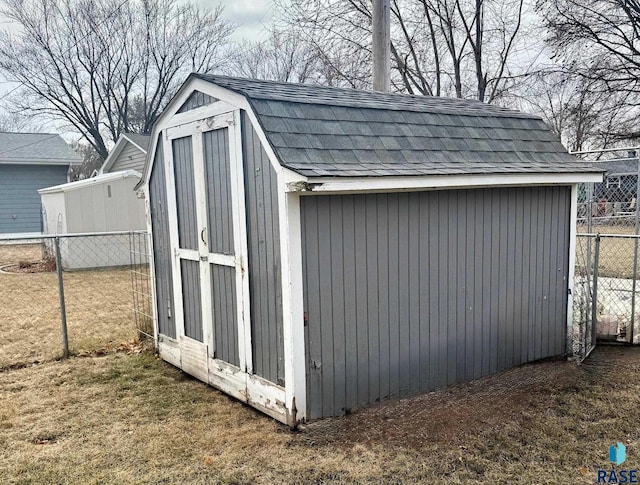 view of outbuilding featuring a lawn