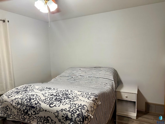 bedroom featuring hardwood / wood-style flooring and ceiling fan