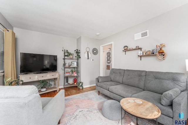 living room with light hardwood / wood-style floors