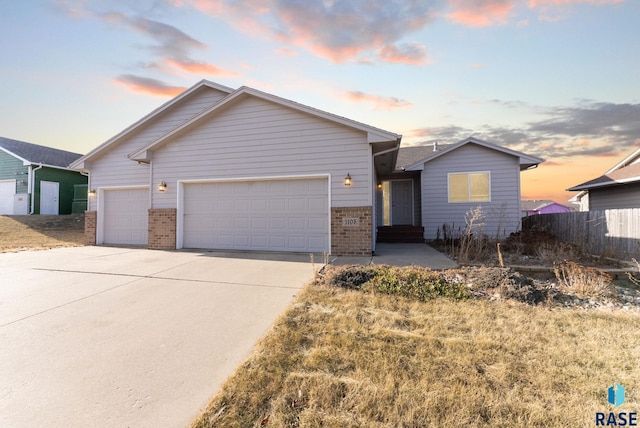 single story home with a garage