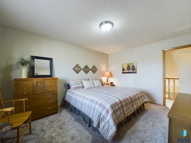 carpeted bedroom with a textured ceiling