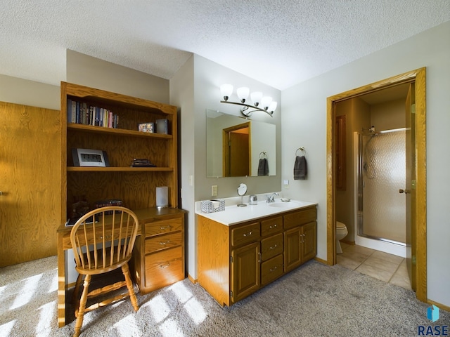 bathroom featuring vanity, toilet, a textured ceiling, a notable chandelier, and a shower with shower door