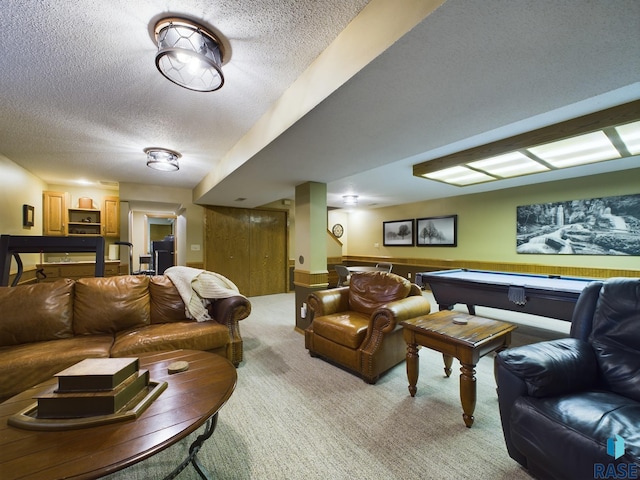 interior space with a textured ceiling and billiards