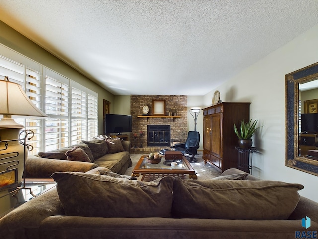 carpeted living room with a fireplace and a textured ceiling