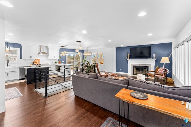 living room featuring dark hardwood / wood-style floors and sink