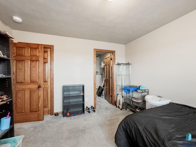 carpeted bedroom with a textured ceiling