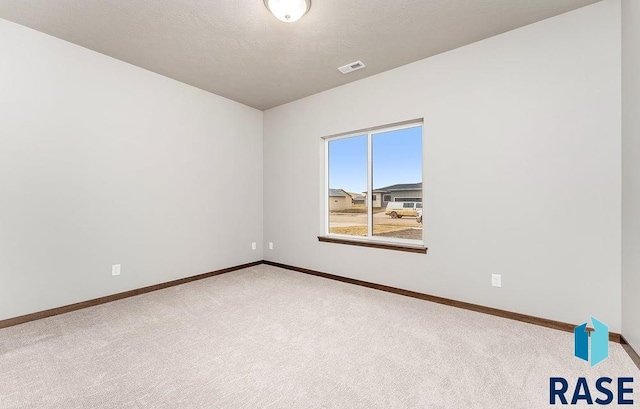 1220 N Rose Ave, Tea, SD 57064 - spare room featuring carpet