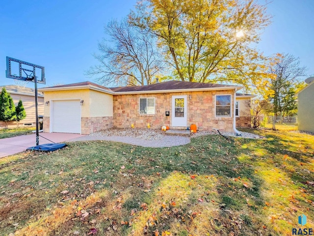 single story home featuring a garage and a front lawn