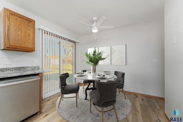 dining space with ceiling fan and light hardwood / wood-style floors