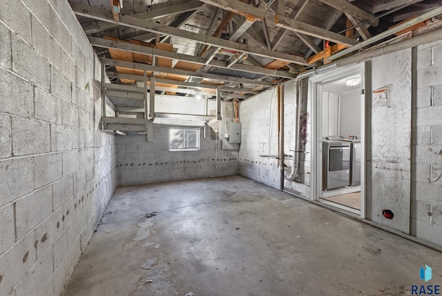 basement with washer and dryer and electric panel