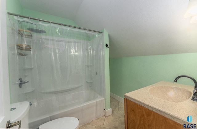 full bathroom featuring vanity, vaulted ceiling, tile patterned flooring, toilet, and shower / tub combo