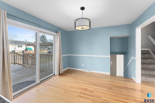 unfurnished dining area with hardwood / wood-style flooring