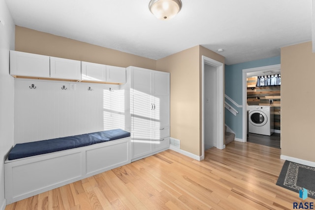 mudroom with washer / clothes dryer and light hardwood / wood-style floors