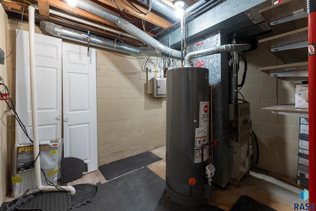 utility room featuring gas water heater