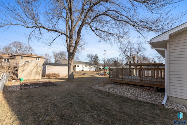 view of yard with a playground and a wooden deck