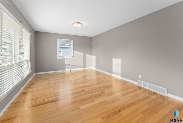 spare room with light wood-type flooring