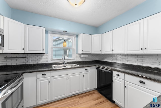 kitchen featuring sink and white cabinets