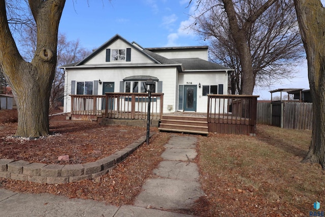 view of front facade with a wooden deck