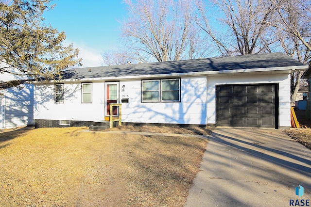 ranch-style home featuring a garage