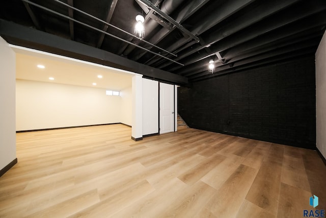 basement featuring light wood-type flooring