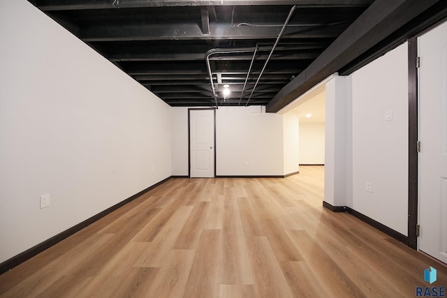 basement featuring light hardwood / wood-style floors