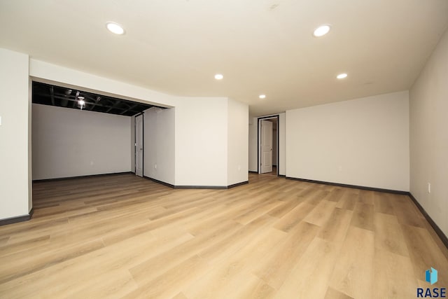 basement featuring light hardwood / wood-style flooring