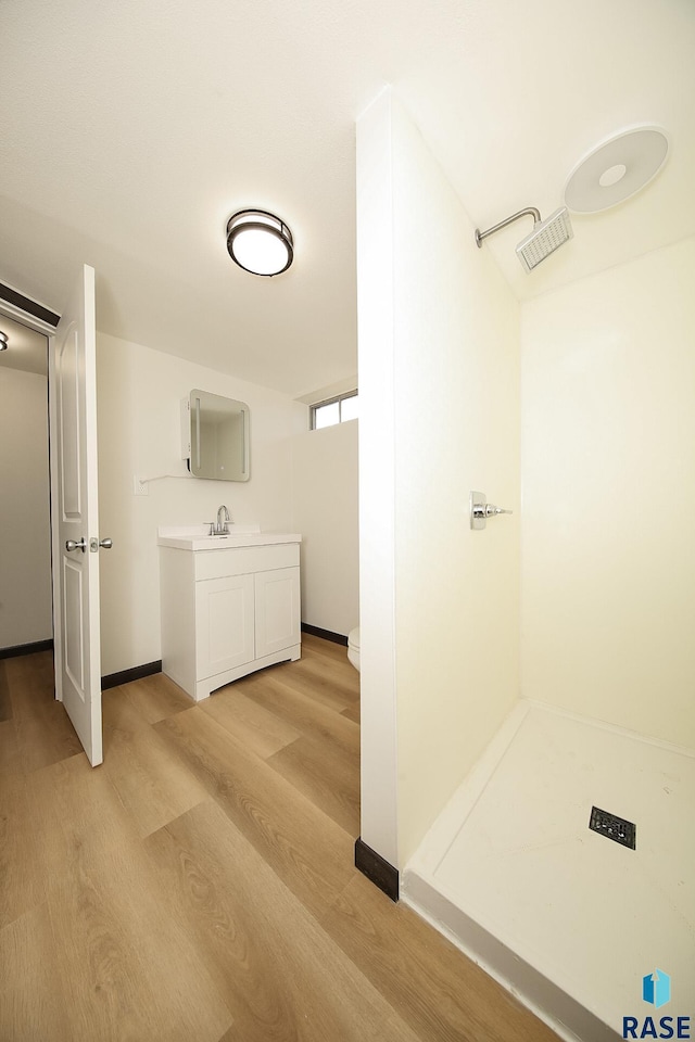 bathroom featuring vanity and hardwood / wood-style flooring