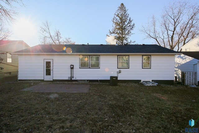 back of house with a lawn, a patio, and central AC unit