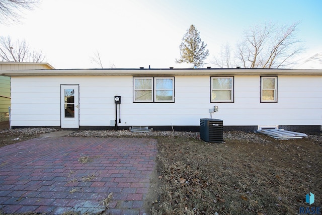 back of house with a patio and cooling unit