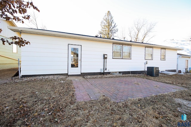 back of house featuring cooling unit and a patio